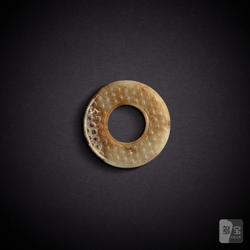 A white and russet jade ring, huan, Eastern Zhou dynasty, Spring and Autumn period | 東周春秋 白玉穀紋環